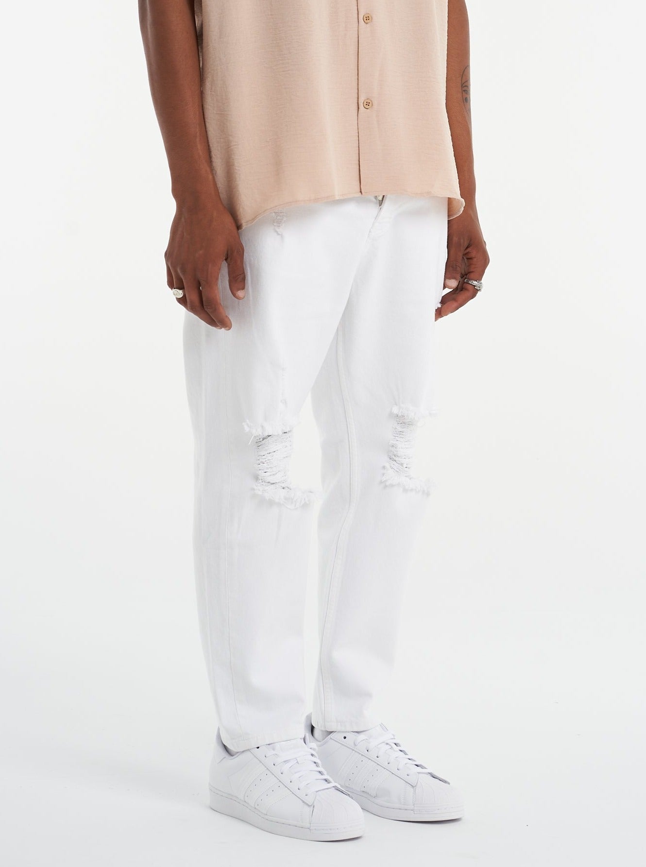 Relaxed Fit Ripped White Jeans - UNEFFECTED STUDIOS® - Pants - UNEFFECTED STUDIOS®