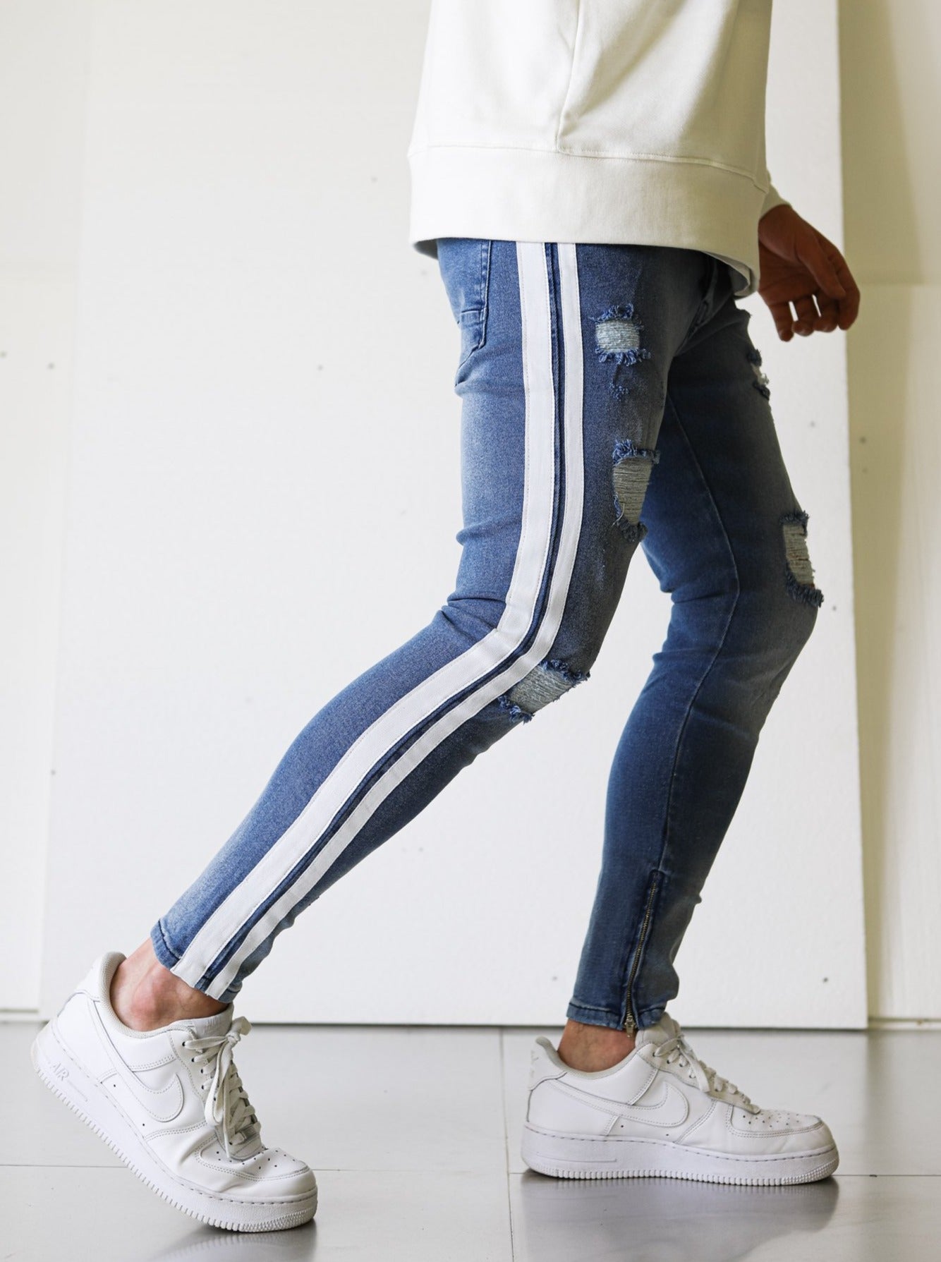 Ripped Blue Jeans with Stripes