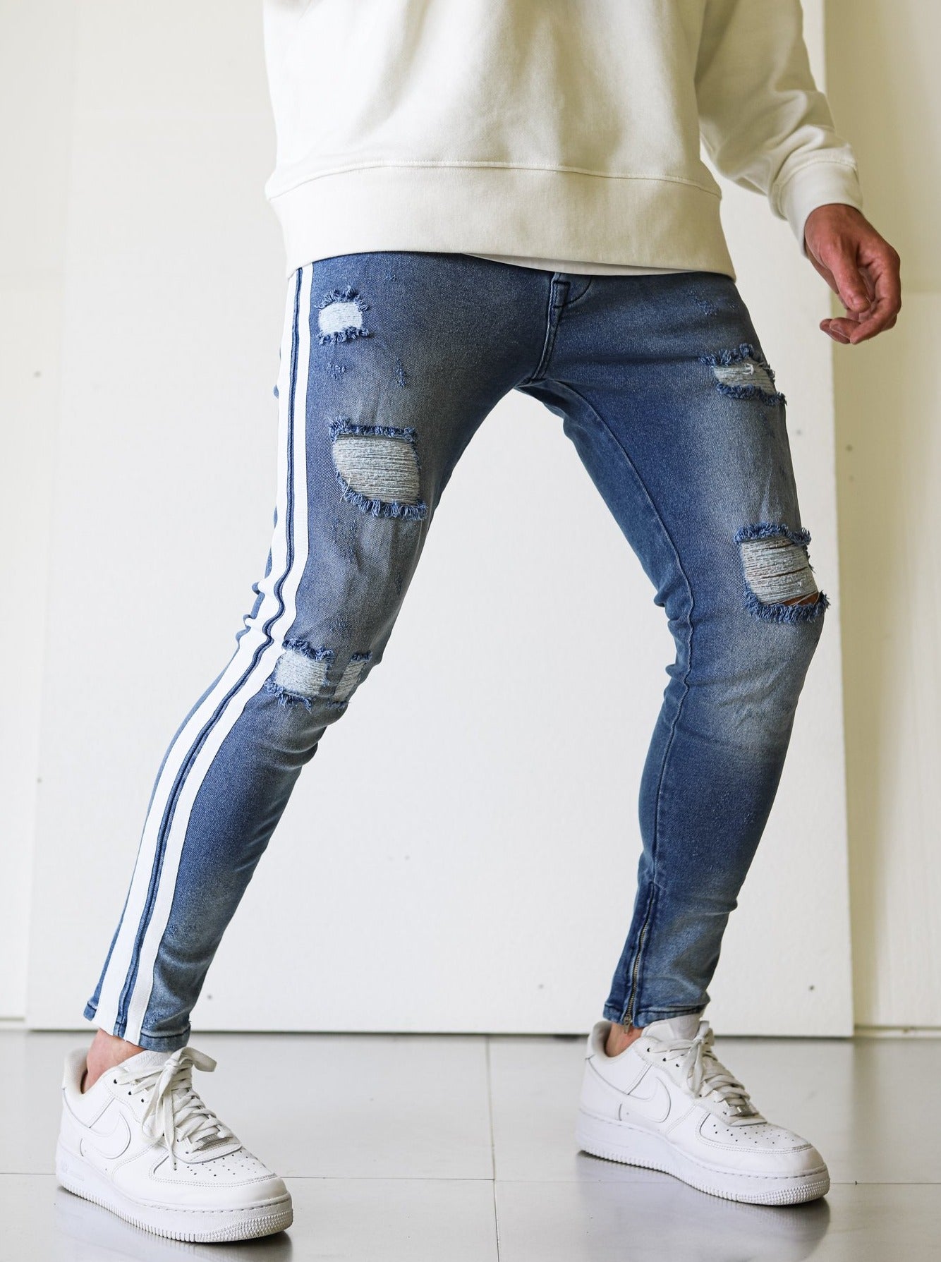Ripped Blue Jeans with Stripes